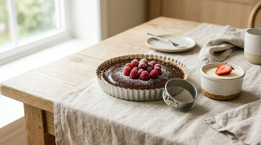 Chocolate ganache tart and no-bake cheesecake cup on a linen tablecloth — summer baking hub