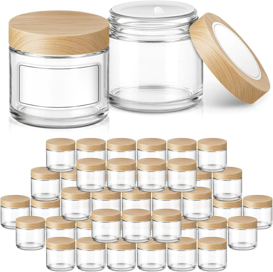 2 oz Glass Jars with Plastic Woodgrain Lids, Bumobum 48 pack Round Clear Cream Jars with Black and White Labels & Inner