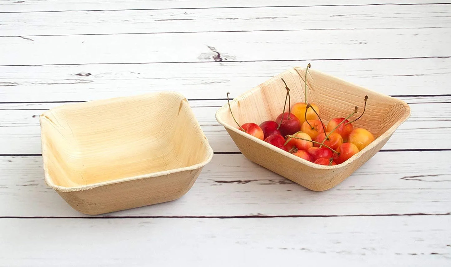 Disposable palm leaf square bowls stacked showing texture and durability for outdoor party gatherings