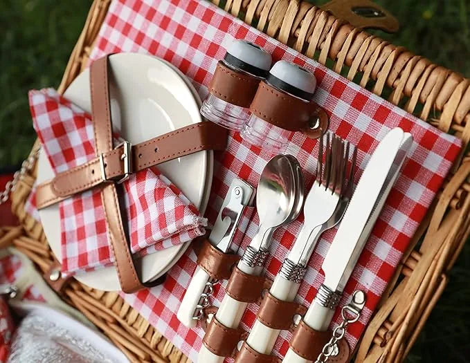 Two person picnic basket displayed next to camping gear for size reference